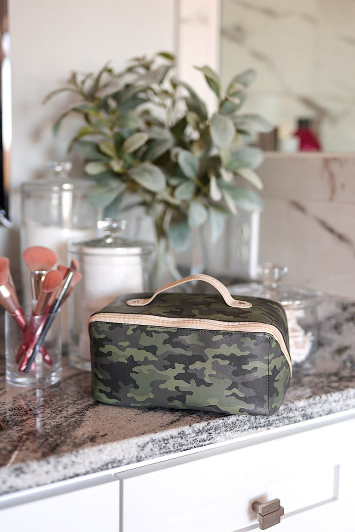 Camo print makeup bag with handle, stylish and spacious for cosmetics and beauty tools.