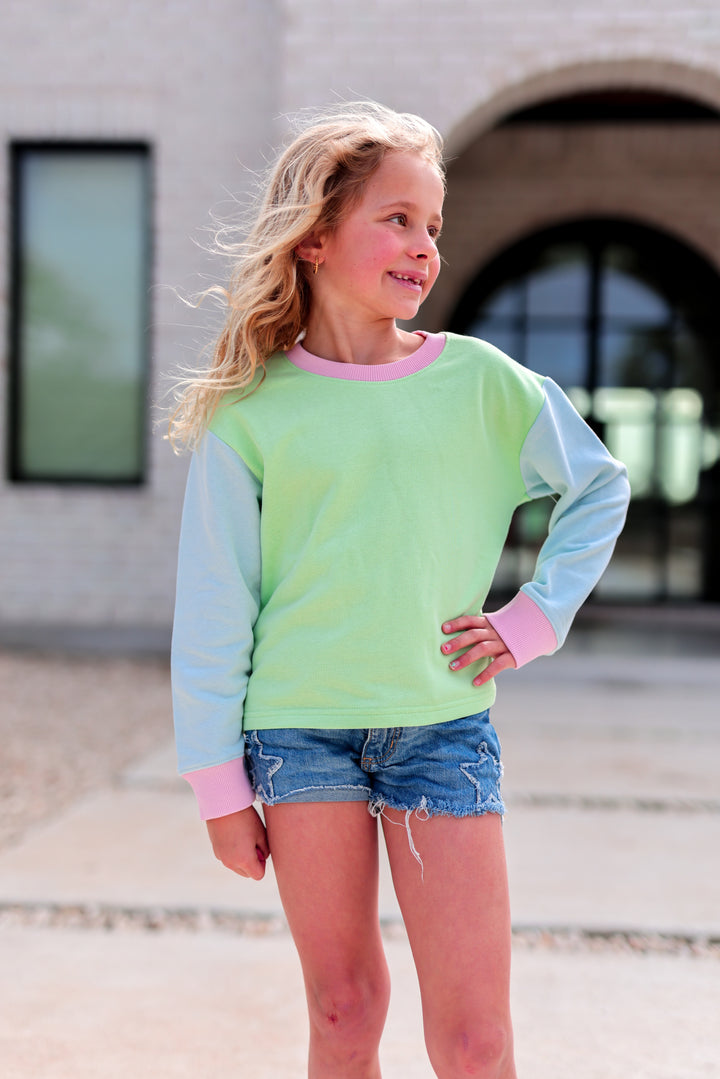 Colorful kids' sweatshirt in mint green and pastel blue, featuring long sleeves and a comfortable fit.