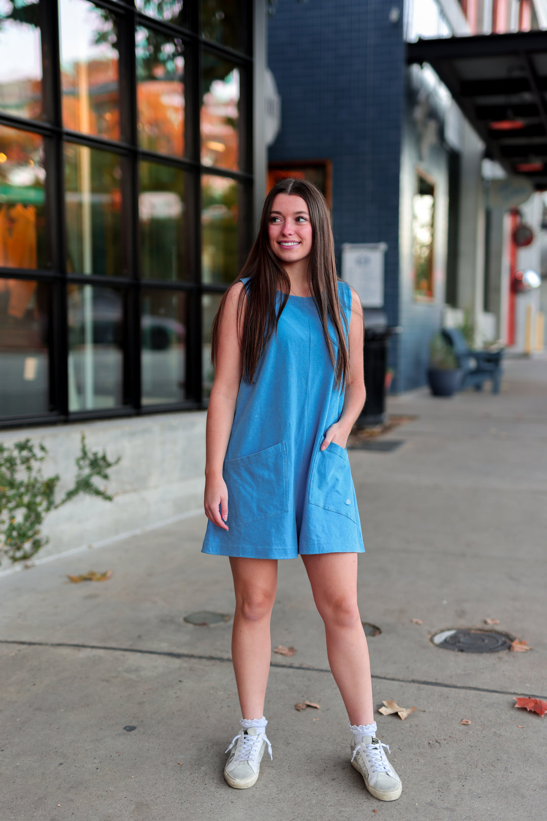 Blue casual sleeveless dress with pockets, perfect for summer outings and comfortable wear.