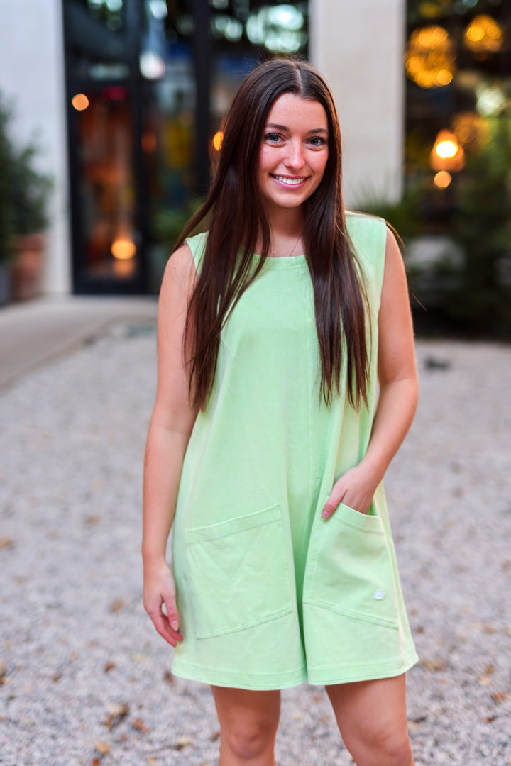 Light green sleeveless romper with pockets, perfect for summer casual wear.