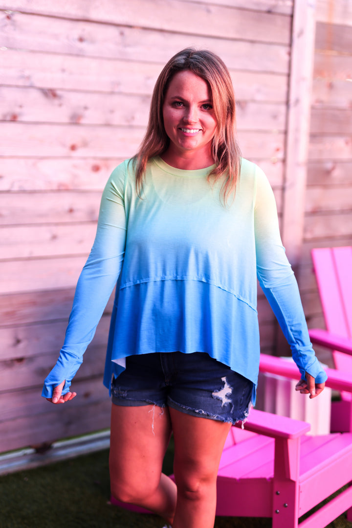 Women's gradient long-sleeve top in green and blue, featuring a relaxed fit and soft material.