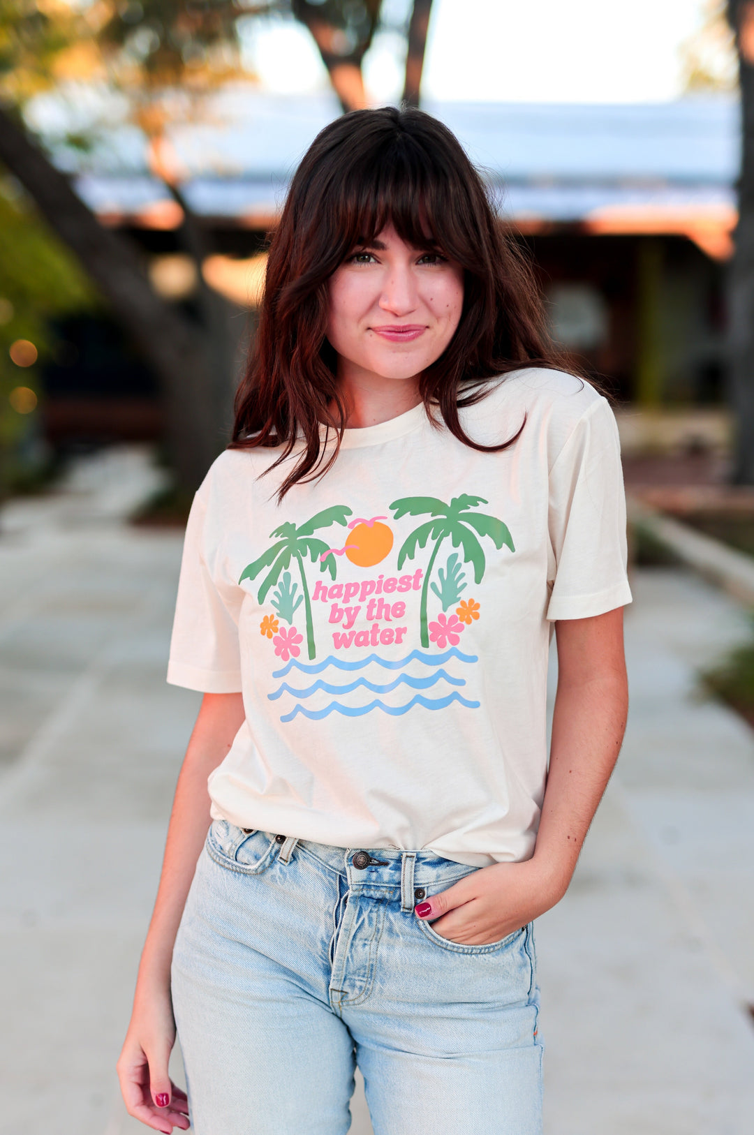 Woman wearing a t-shirt with a graphic design outdoors