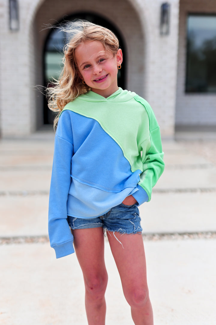 Girls' color-block hoodie in green and blue, made of soft cotton, stylish and comfortable for casual wear.