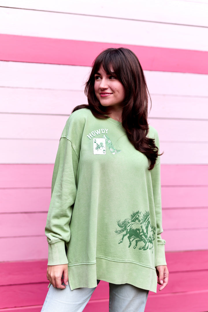 Light green oversized sweatshirt with 'Howdy' print and horse design, perfect for casual wear.