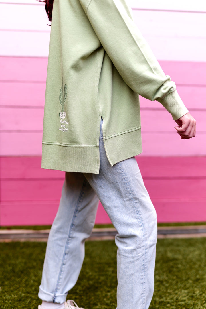Light green oversized sweatshirt with cactus embroidery, side slits, perfect for casual wear.