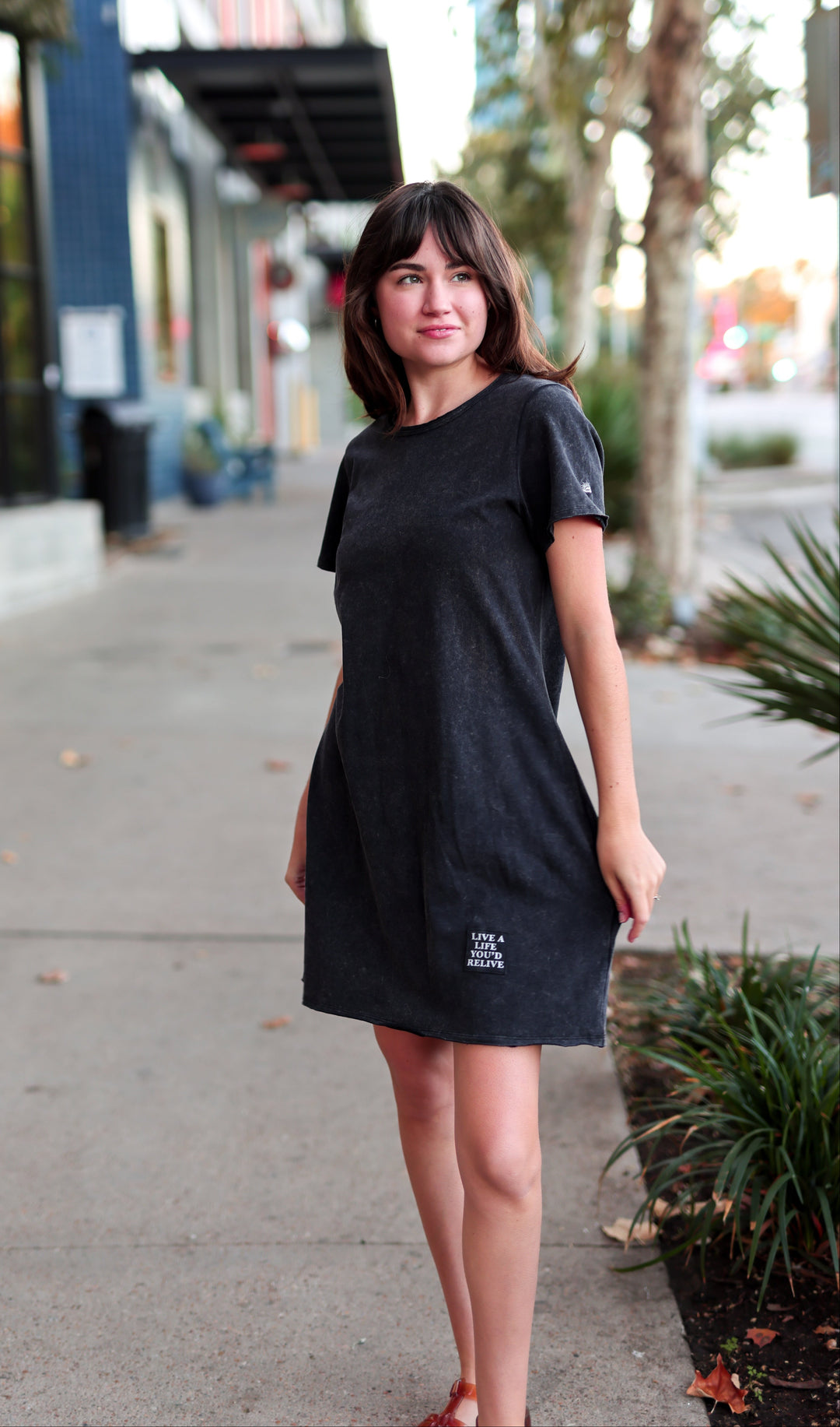 Casual black cotton t-shirt dress with unique embroidery, perfect for everyday wear.
