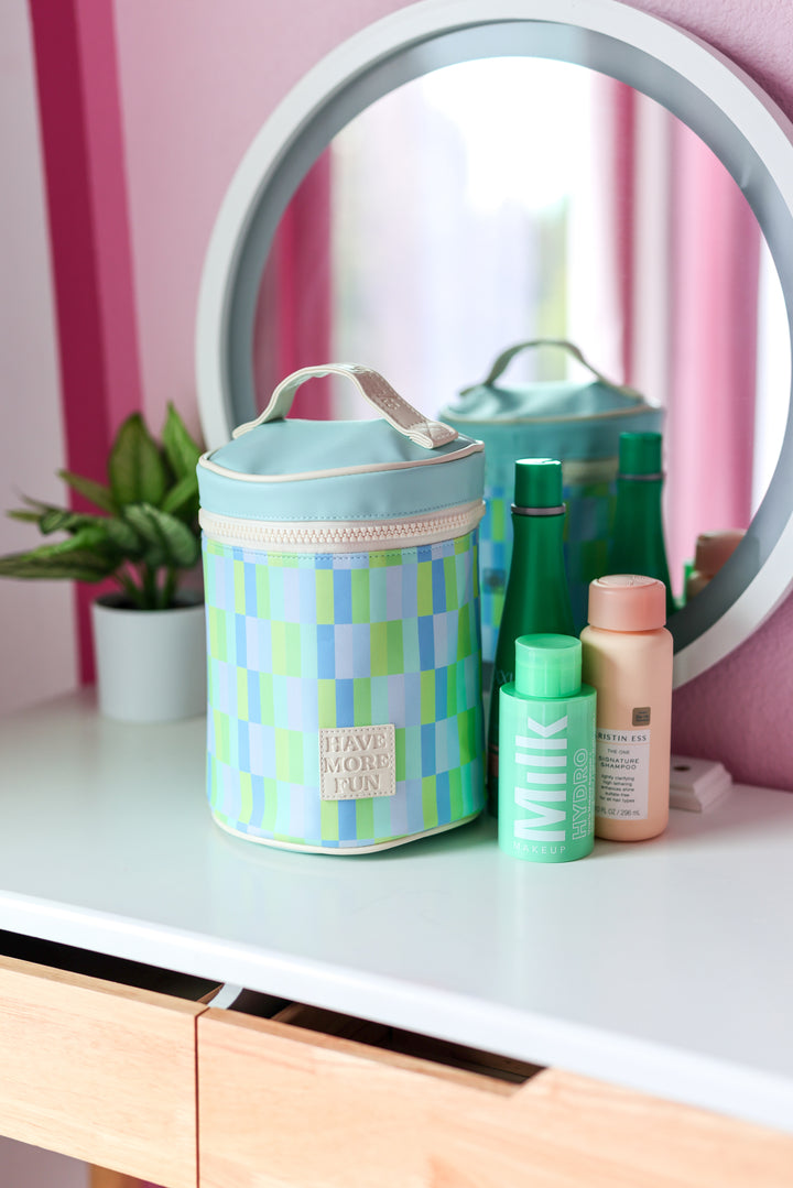 Colorful cosmetic bag in blue and green, perfect for storing makeup and beauty products.