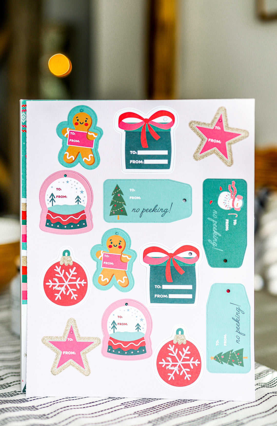 Festive holiday gift tags set featuring gingerbread, snowflakes, and colorful decorations, perfect for Christmas.
