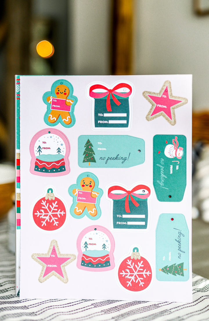 Festive holiday gift tags set featuring gingerbread, snowflakes, and colorful decorations, perfect for Christmas.